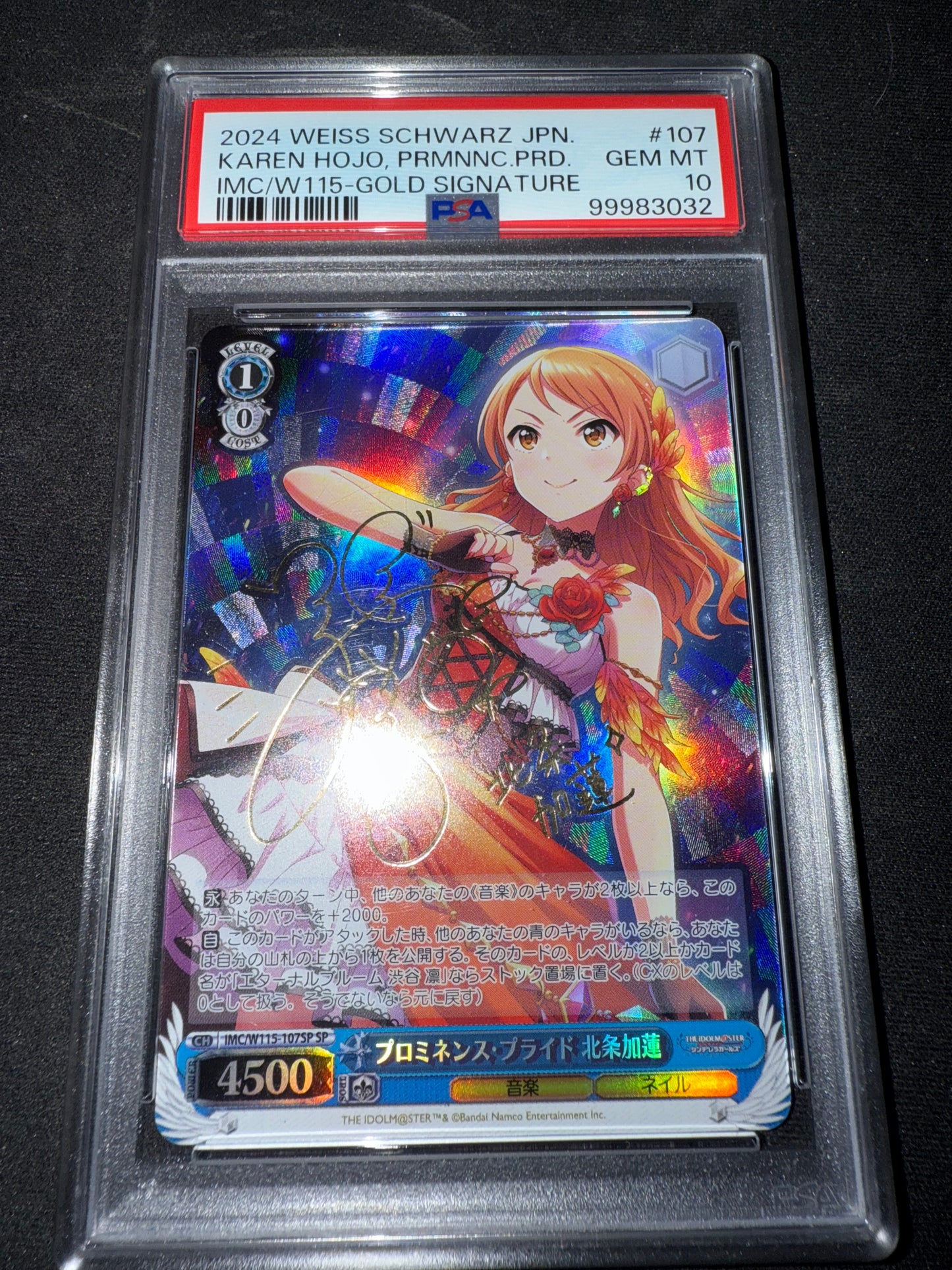 In person front of 2024 WEISS SCHWARZ JAPANESE THE IDOLMASTER CINDERELLA GIRLS NEXT TWINKLE! #107 KAREN HOJO, PRMNNC.PRD. IMC/W115-GOLD SIGNATURE PSA 10