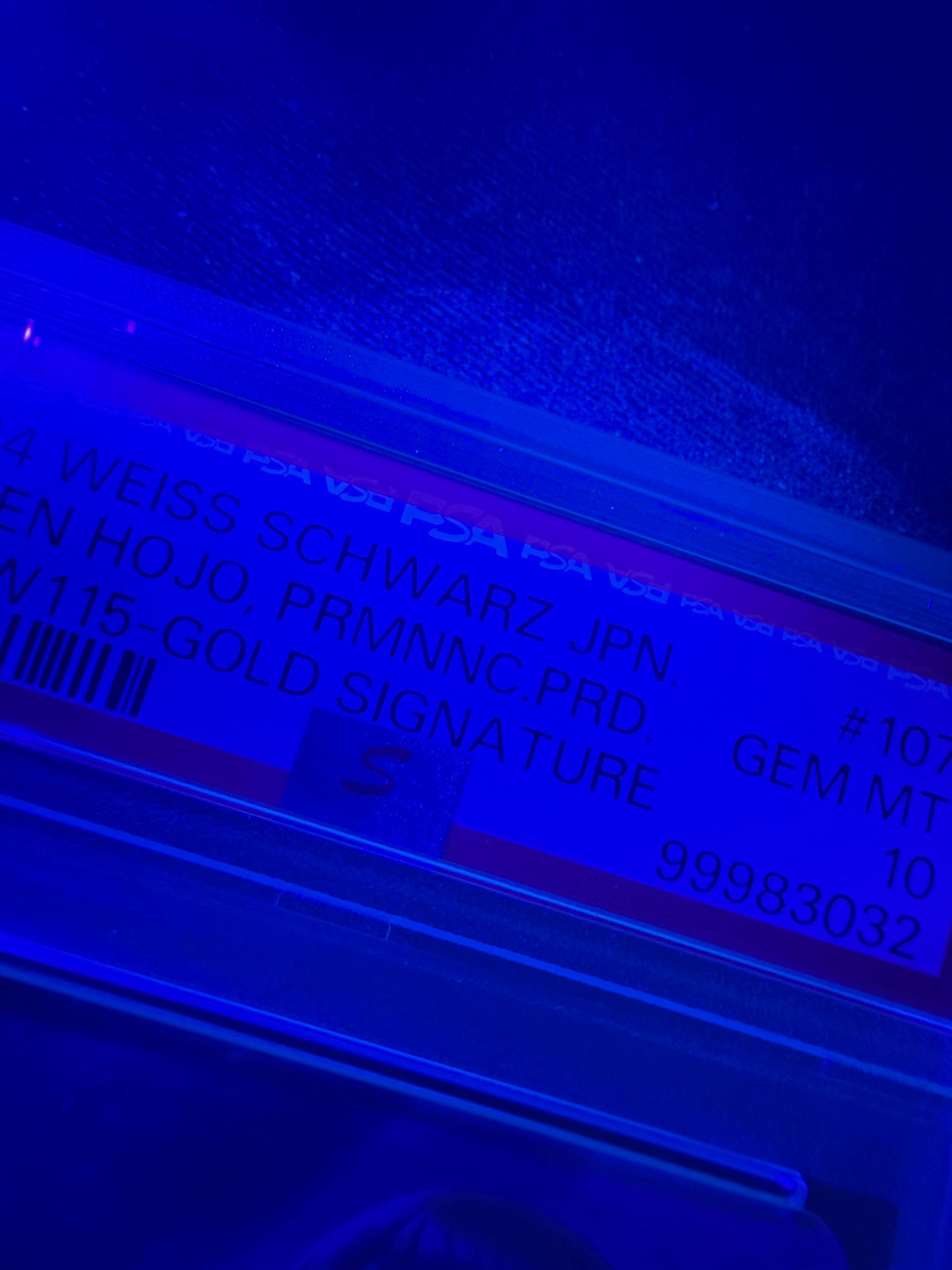 black light photo of 2024 WEISS SCHWARZ JAPANESE THE IDOLMASTER CINDERELLA GIRLS NEXT TWINKLE! #107 KAREN HOJO, PRMNNC.PRD. IMC/W115-GOLD SIGNATURE PSA 10