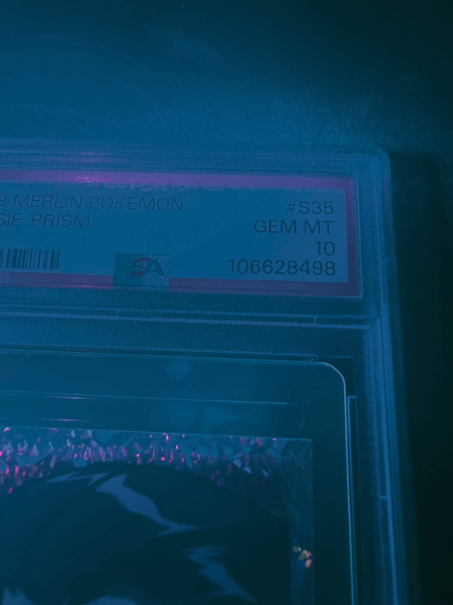 black light photo of 1999 MERLIN POKEMON #S35 JESSIE-PRISM PSA 10 #106628498 with cozy filter