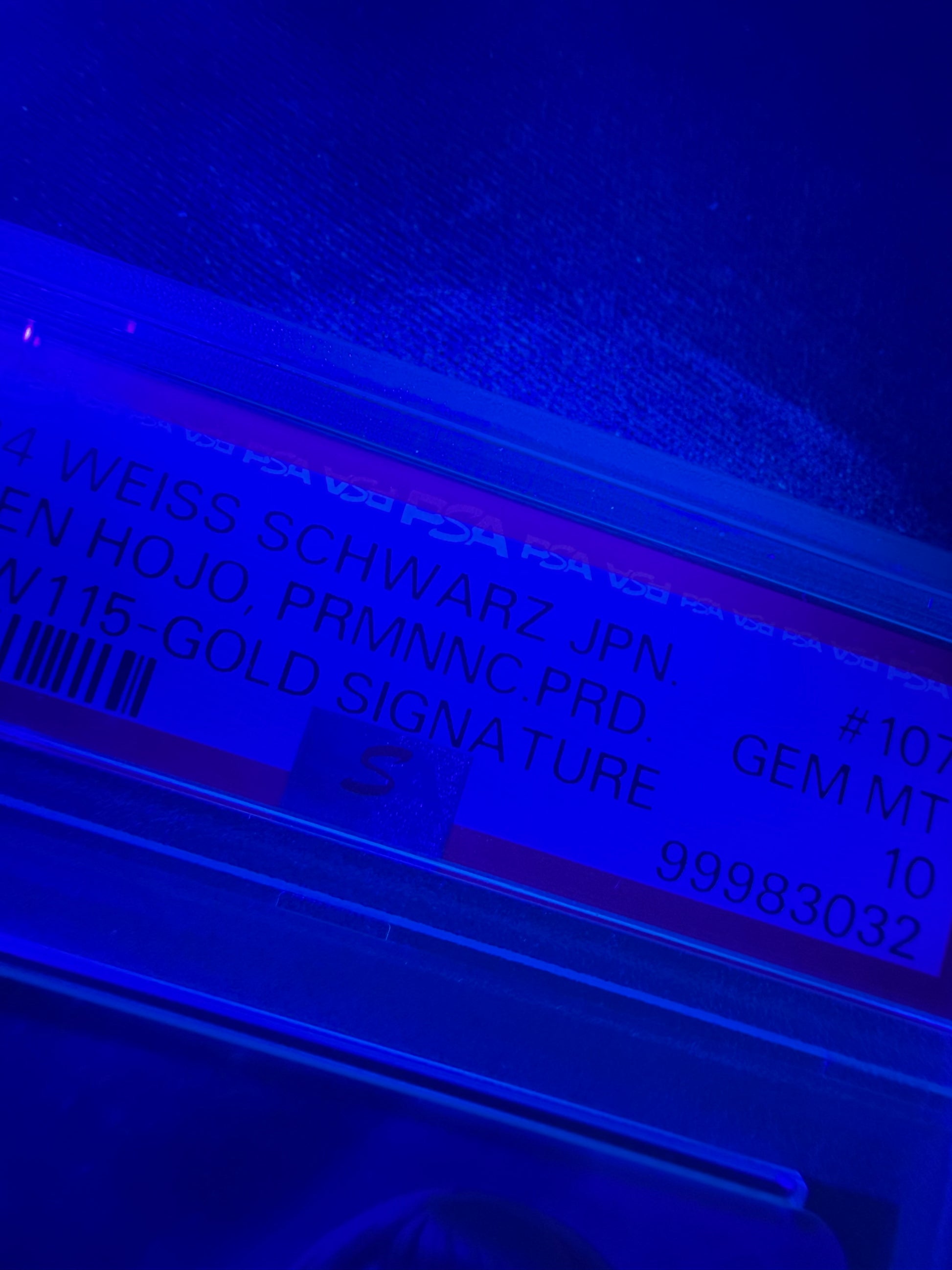 black light photo of 2024 WEISS SCHWARZ JAPANESE THE IDOLMASTER CINDERELLA GIRLS NEXT TWINKLE! #107 KAREN HOJO, PRMNNC.PRD. IMC/W115-GOLD SIGNATURE PSA 10