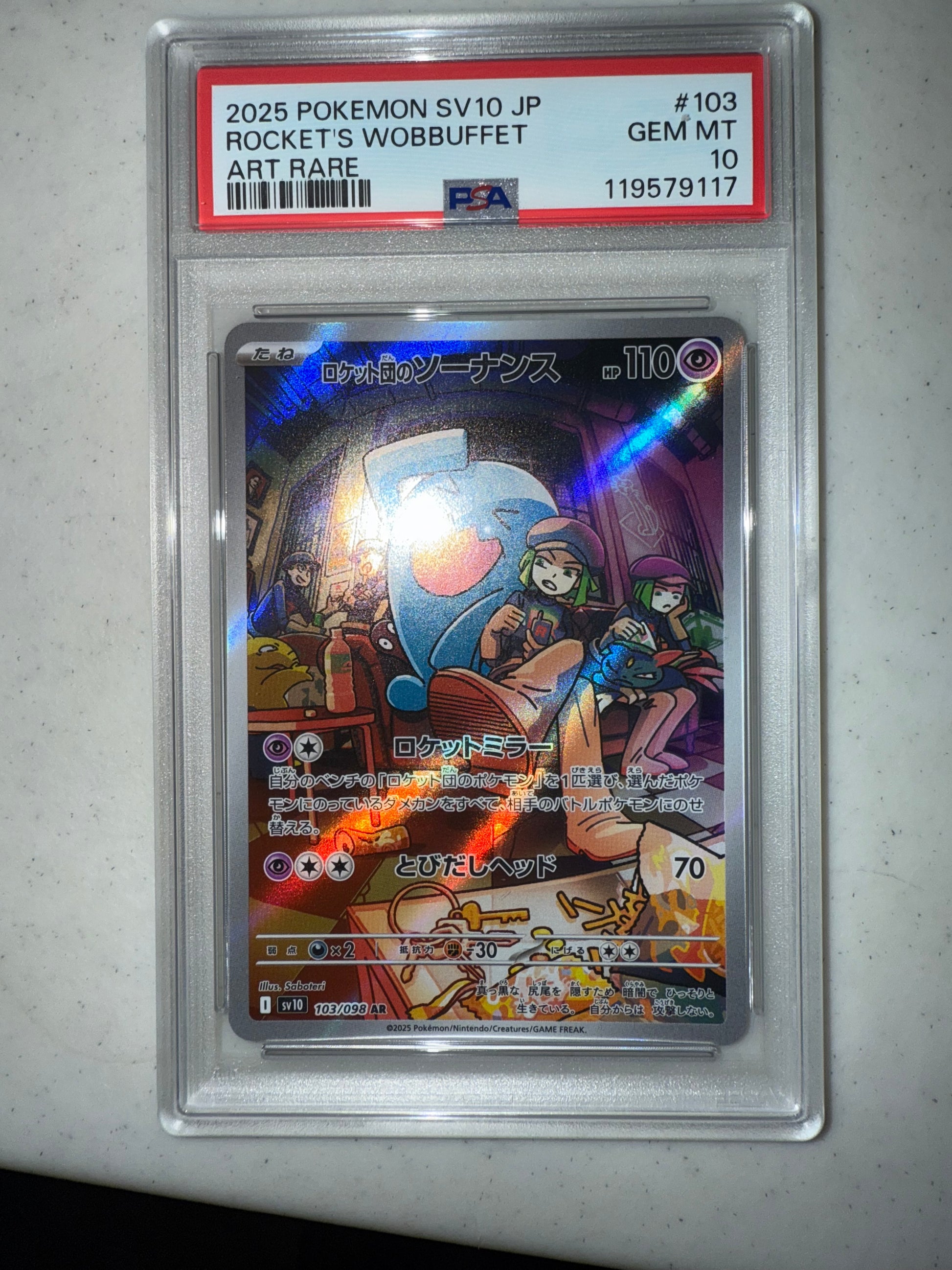 irl front of 2025 POKEMON JAPANESE SV10-GLORY OF TEAM ROCKET #103 ROCKET'S WOBBUFFET ART RARE #119579117 PSA 10